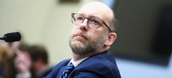 Russ Vought in glasses during meeting