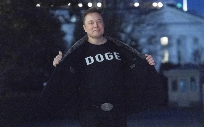 Elon Musk wearing a t-shirt that says 